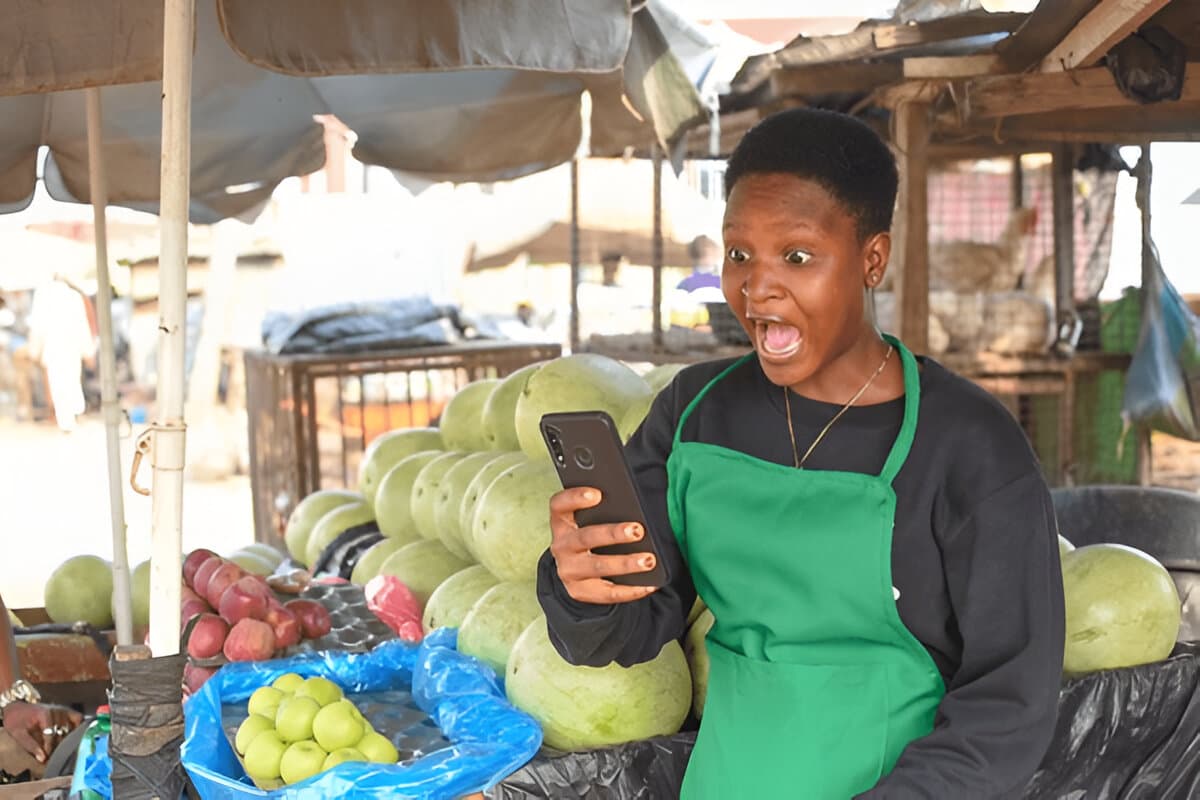 Happy vendor with phone